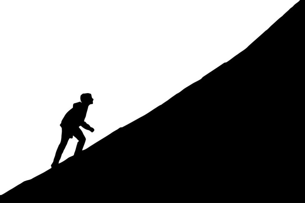 person walking up hill